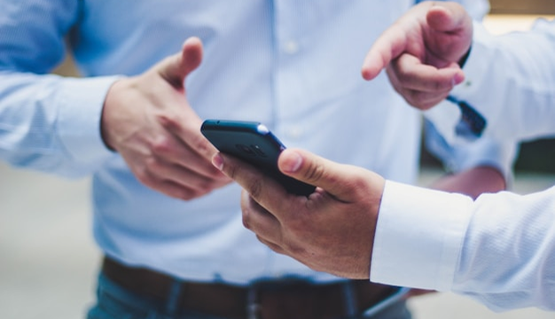 Business meeting with PDF-based data visuals shown as video content on screen using Visla